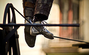 The feet of a tightrope walker.