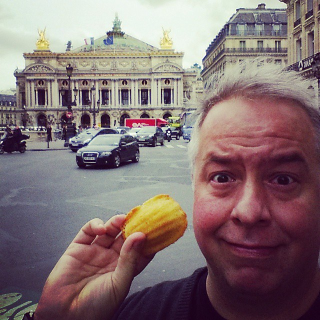 Chris Abraham in Paris France with a Madeleine