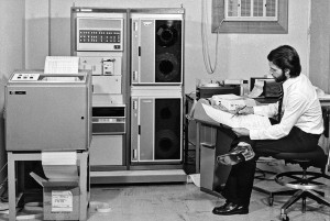 In this historical image, taken in 1974 in the ESO offices in Santiago, Chile, we can see the Austrian astronomer Rudi Albrecht, pencil in hand, poring over code in front of a teletype. He was working on software for the Spectrum Scanner attached to the ESO 1-metre telescope located at the La Silla Observatory. The data were processed in Santiago using the Hewlett Packard 2116 minicomputer which can be seen behind the printer. This bulky computer, with one processor and a breathtaking 16 kilobytes of magnetic-core memory (!), stored the results on magnetic tape, ready for further processing by visiting astronomers on computers at their home institutes. To handle files on tape that were larger than the available memory, Albrecht developed a virtual memory system, which he contributed to the Hewlett Packard Software Center.