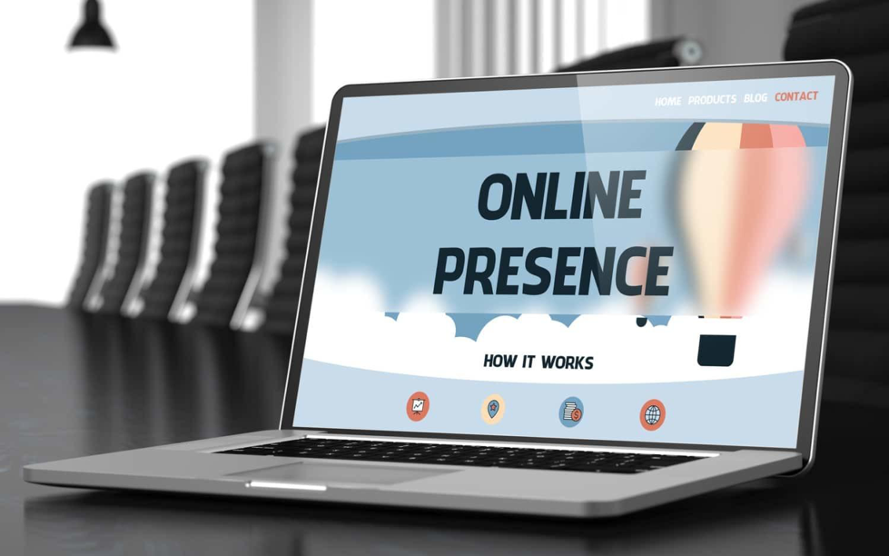A laptop open with the text "online presence"